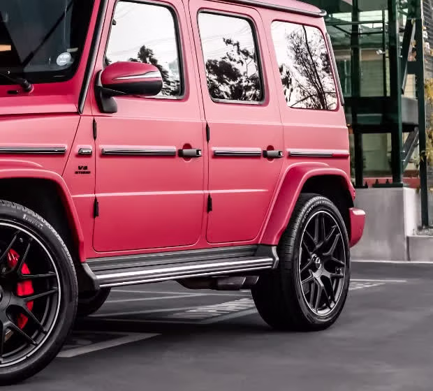 Close-up of the matte red metallic doors and flank on a Mercedes-AMG G63 by Monarch Wrap & Tint